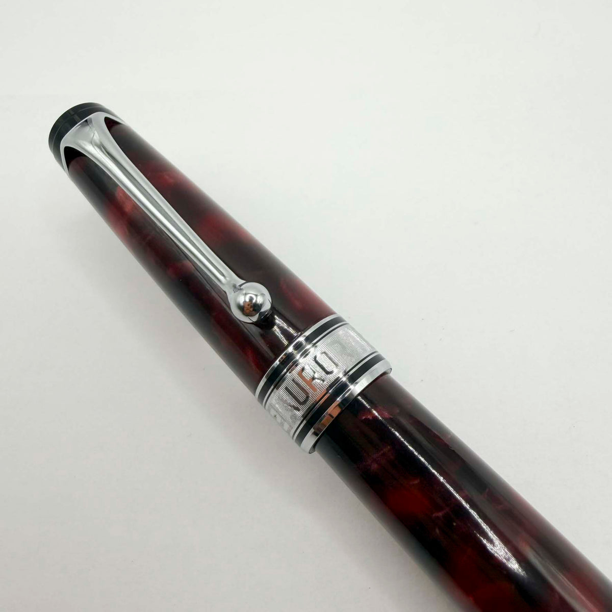 Aurora Optima Marbled Burgundy Auroloide Fountain Pen - Fine 14kt Gold Nib