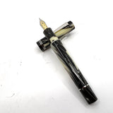 Delta "The Journal" Fountain Pen -Ivory Backdrop with Black/Brown Swirls