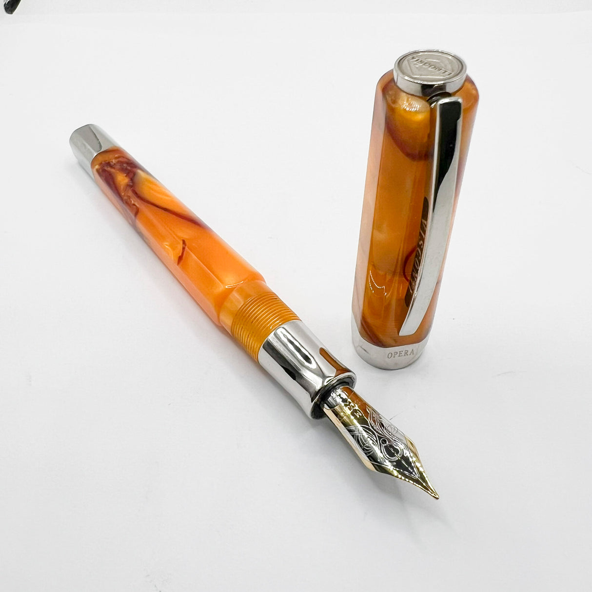 Visconti Opera Fountain Pen with Burgundy Streaking on Amber Backdrop - Medium 14kt Gold Nib
